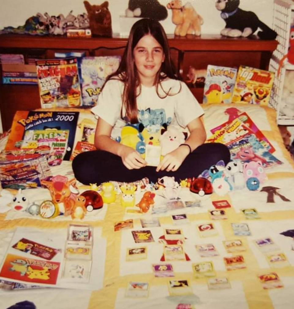 posing with all his pokemon in bed