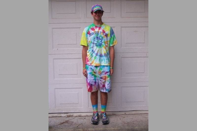 tie dye outfit in front of garage