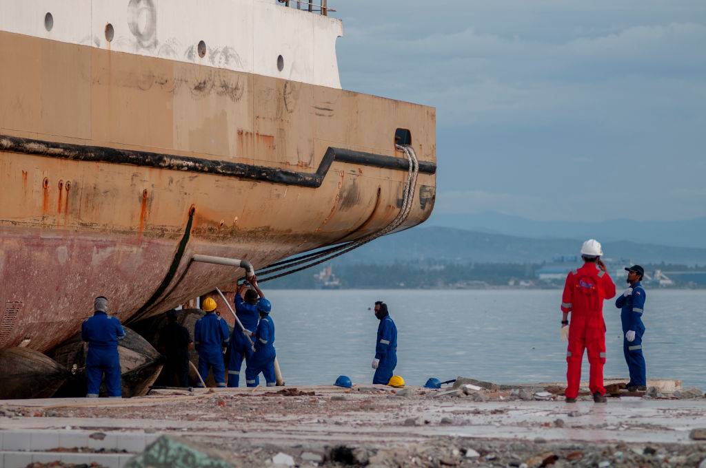 workers looking at a docked ship