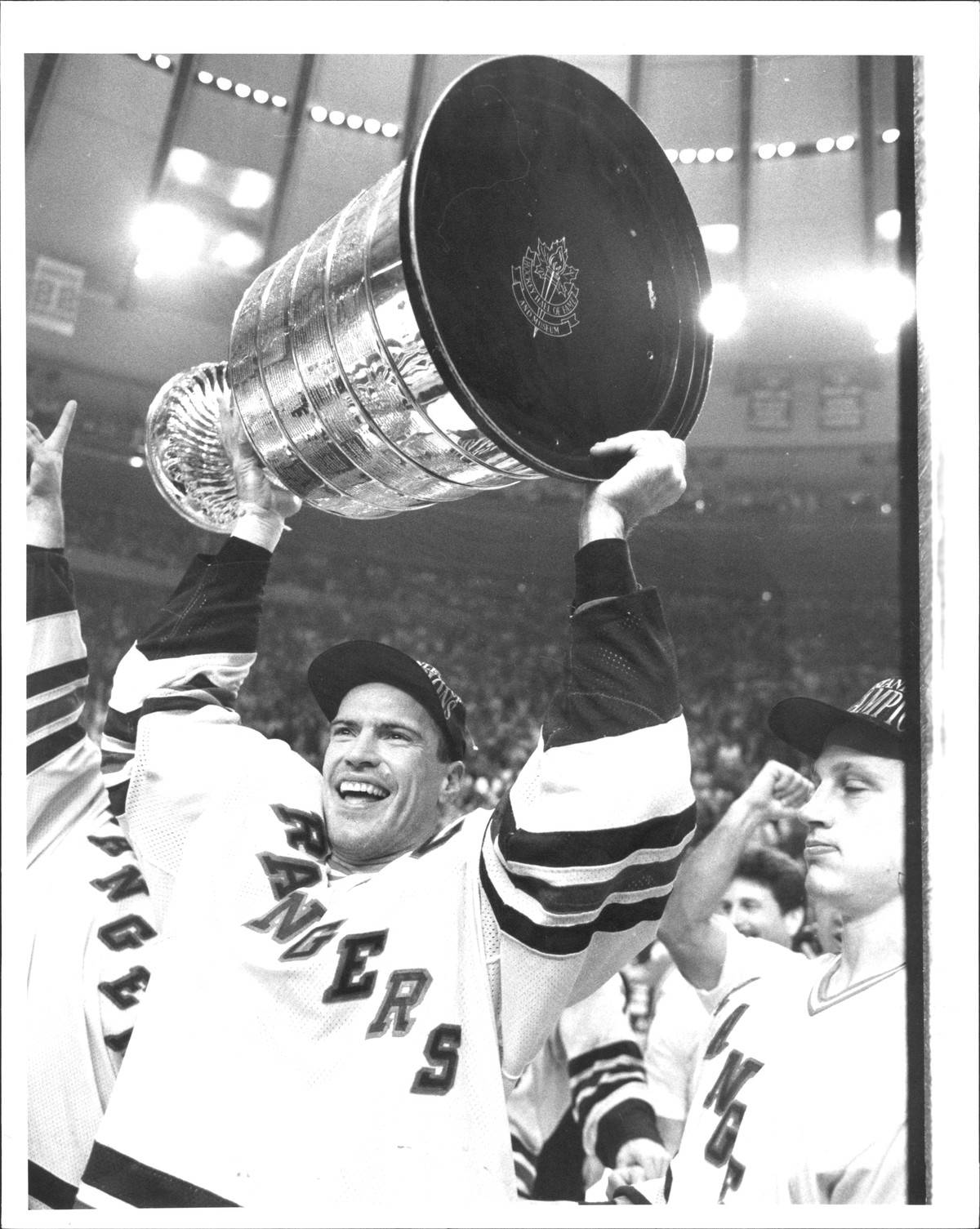 New York Rangers Mark Messier holds the Stanley Cup over his head in 1994.