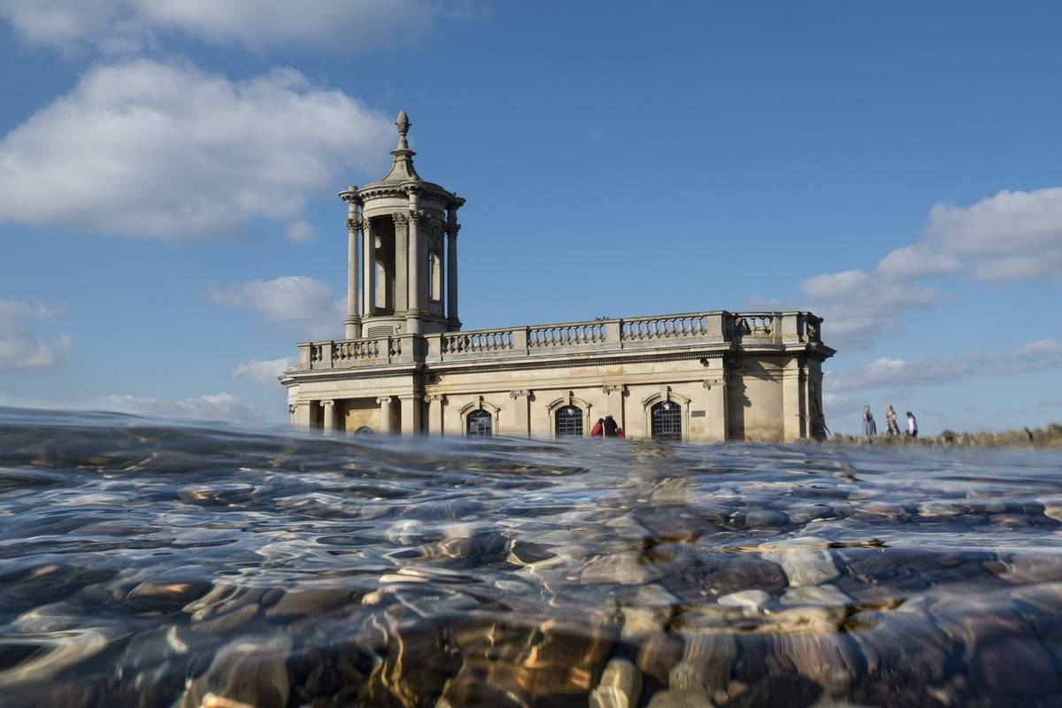A view from water level shows Normanton Church in England.