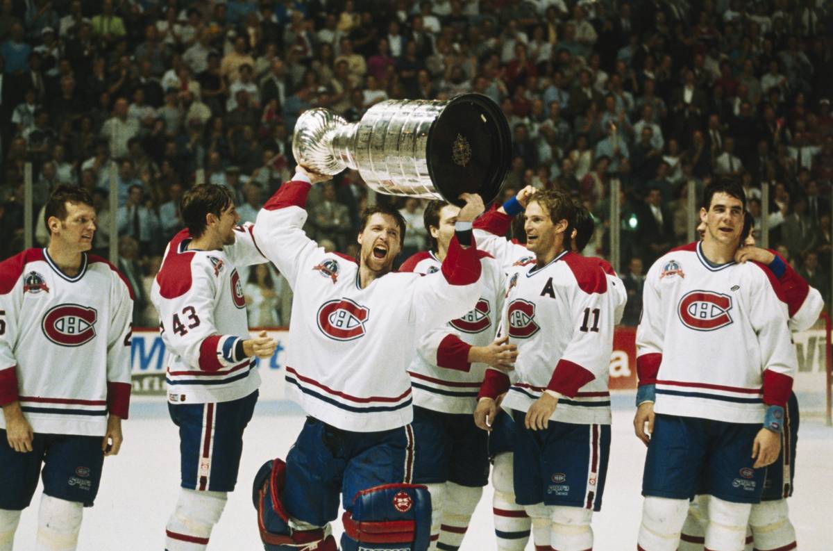 Patrick Roy raises the 1993 Stanley Cup.