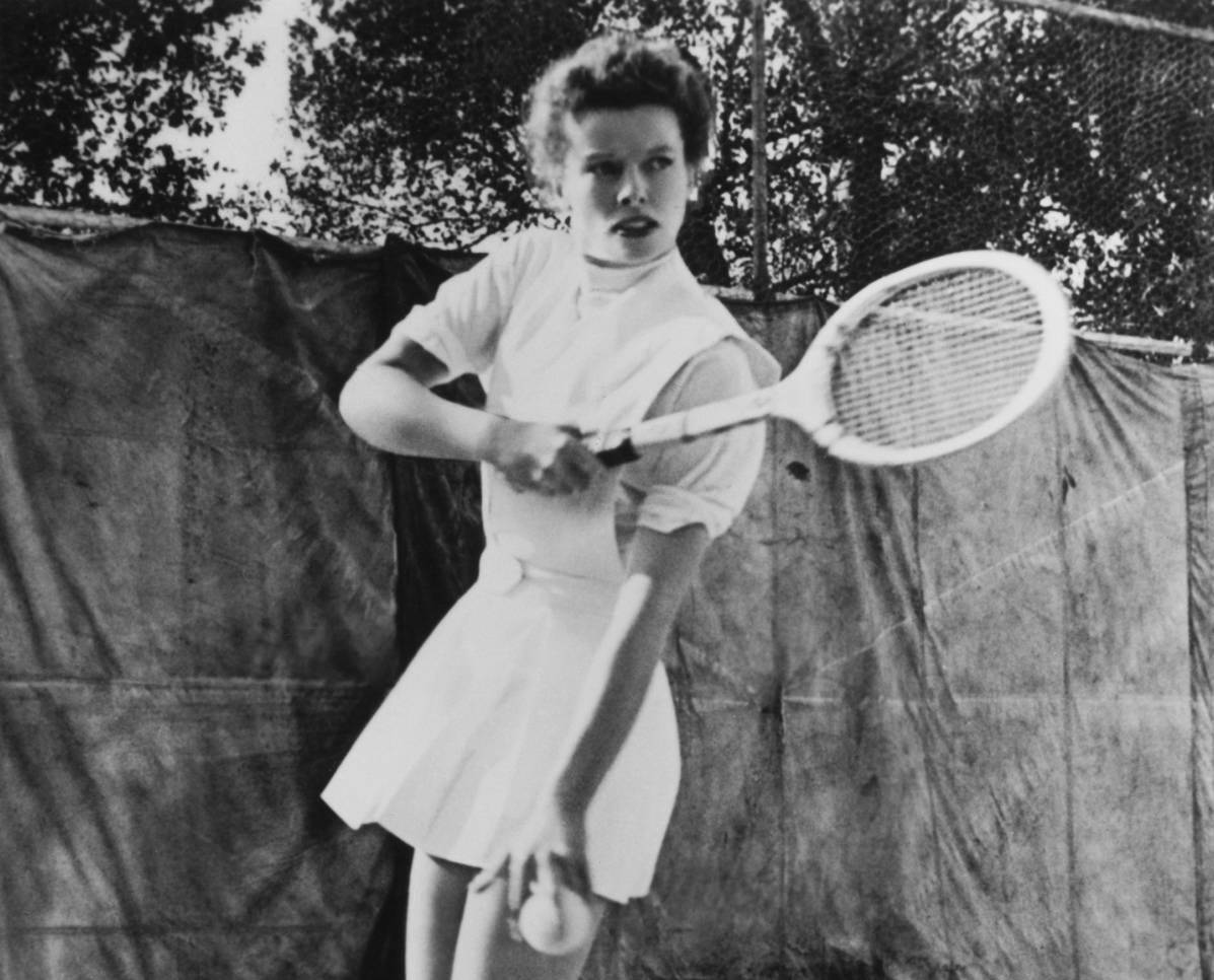 Katharine Hepburn playing tennis.