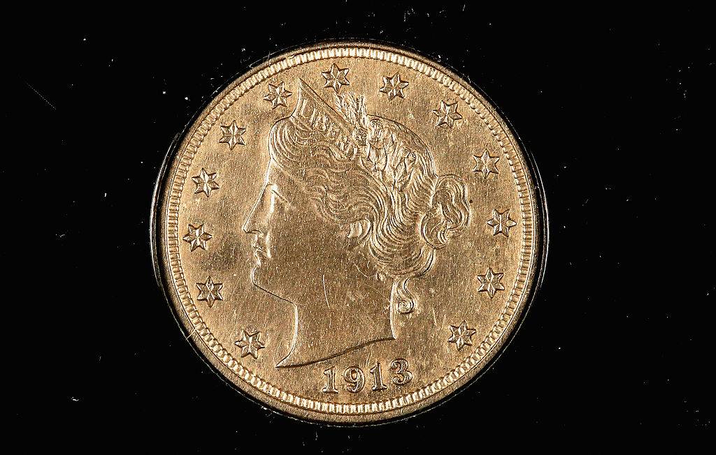 1913 liberty head nickel against a black background