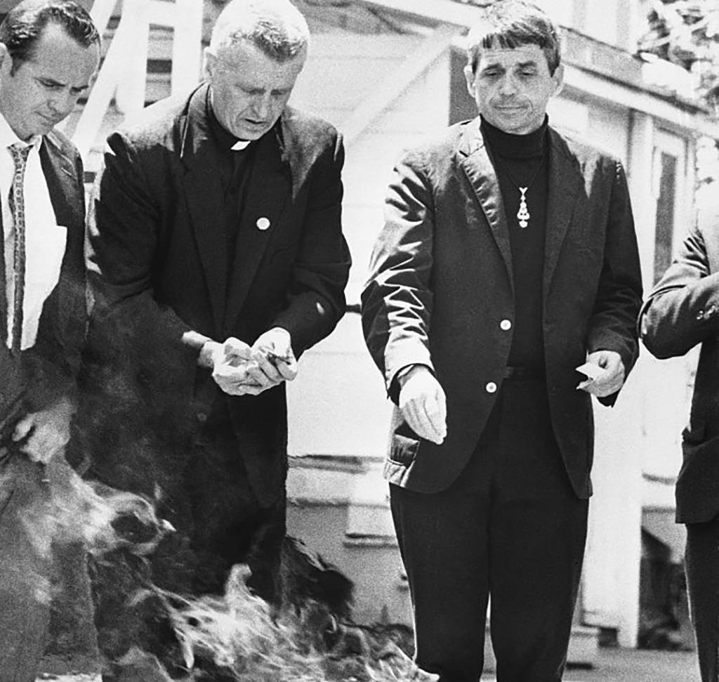 Priests burning draft cards