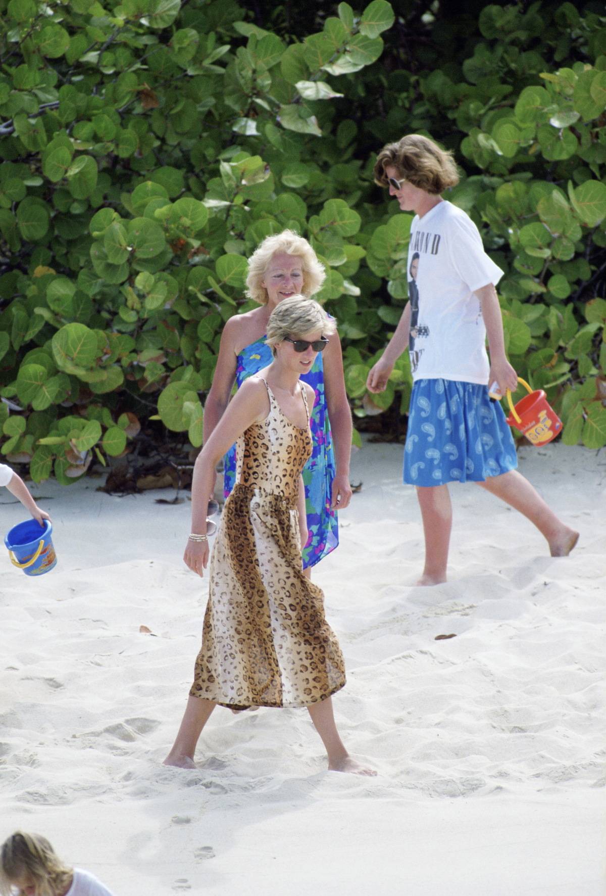 Princess Diana joins Her Mother Frances Shand-kydd And Sister Lady Jane Fellowes On Necker Island in a leopard print dress.