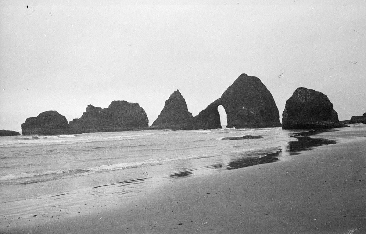 Rock formations are seen on a beach in this 1938 photograph.
