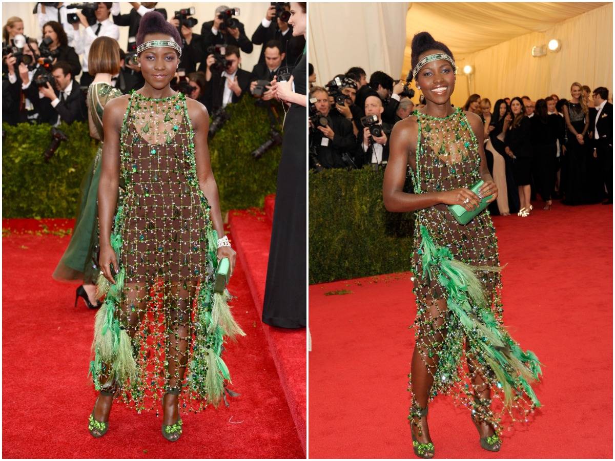 Lupita Nyong'o poses for photos while at the 2014 Met Gala.