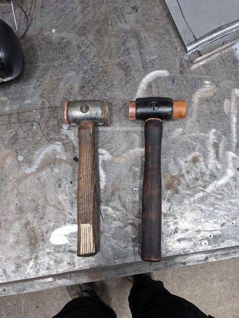 worn hammer next to new hammer