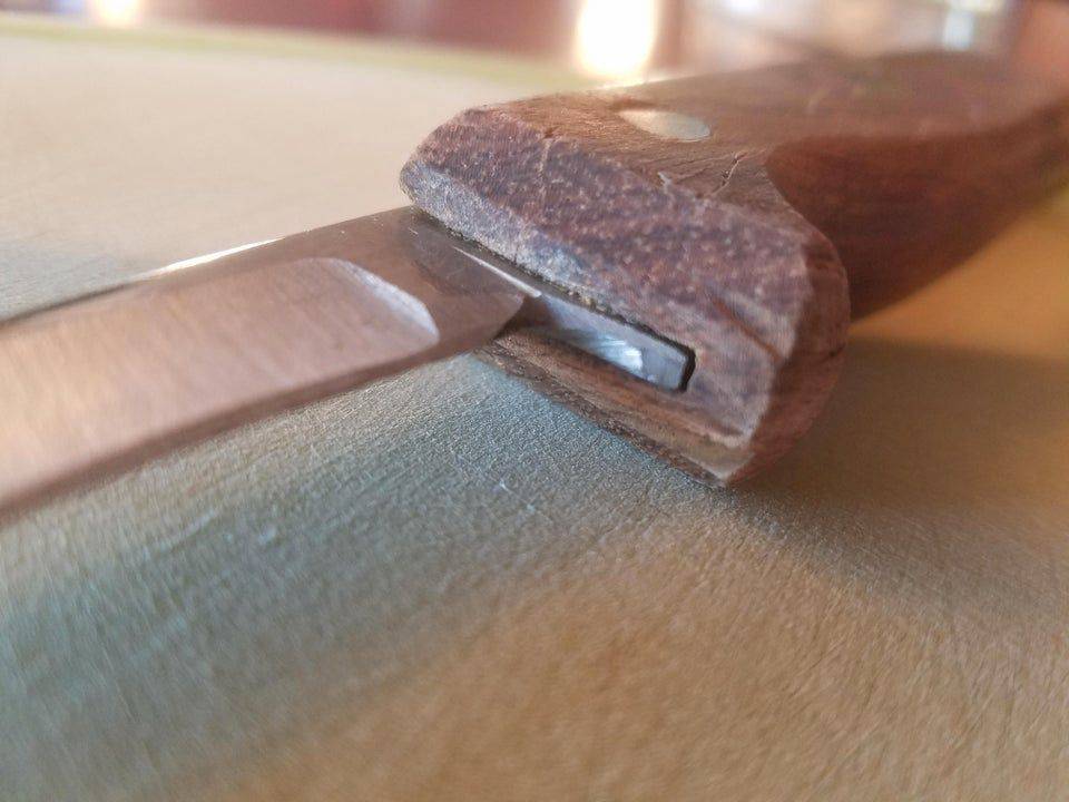 knife sharpened to half original size