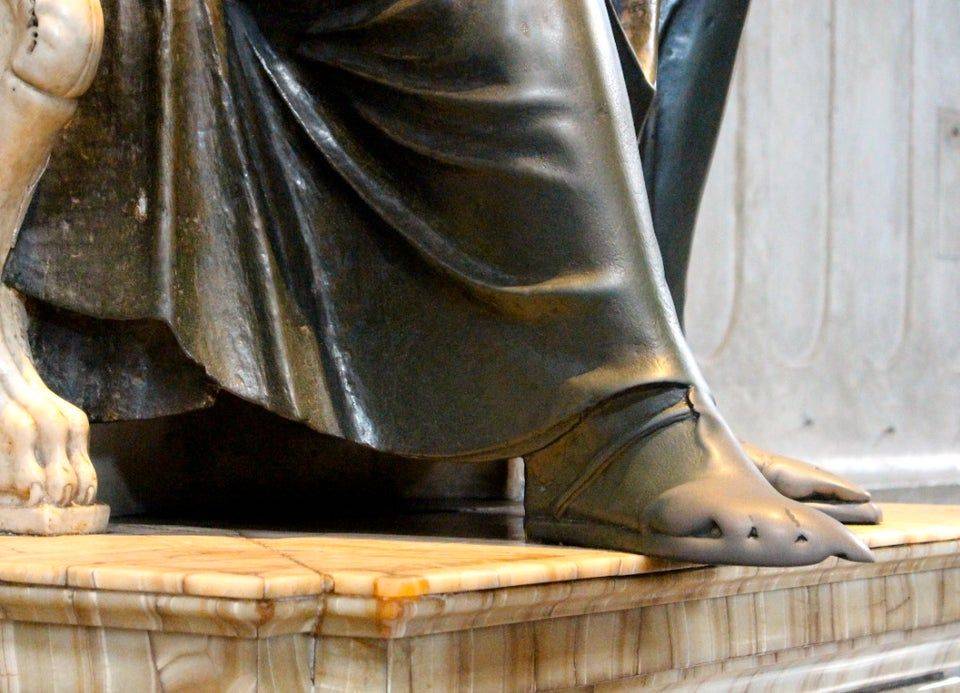 rubbed statue toes