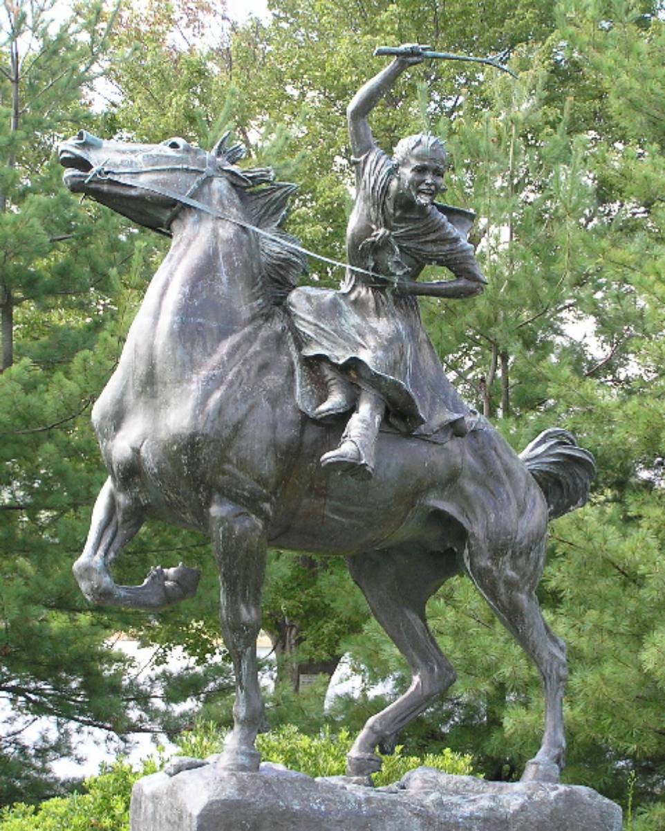 This statue memorial portrays Sybil Ludington riding on a horse while waving a stick.