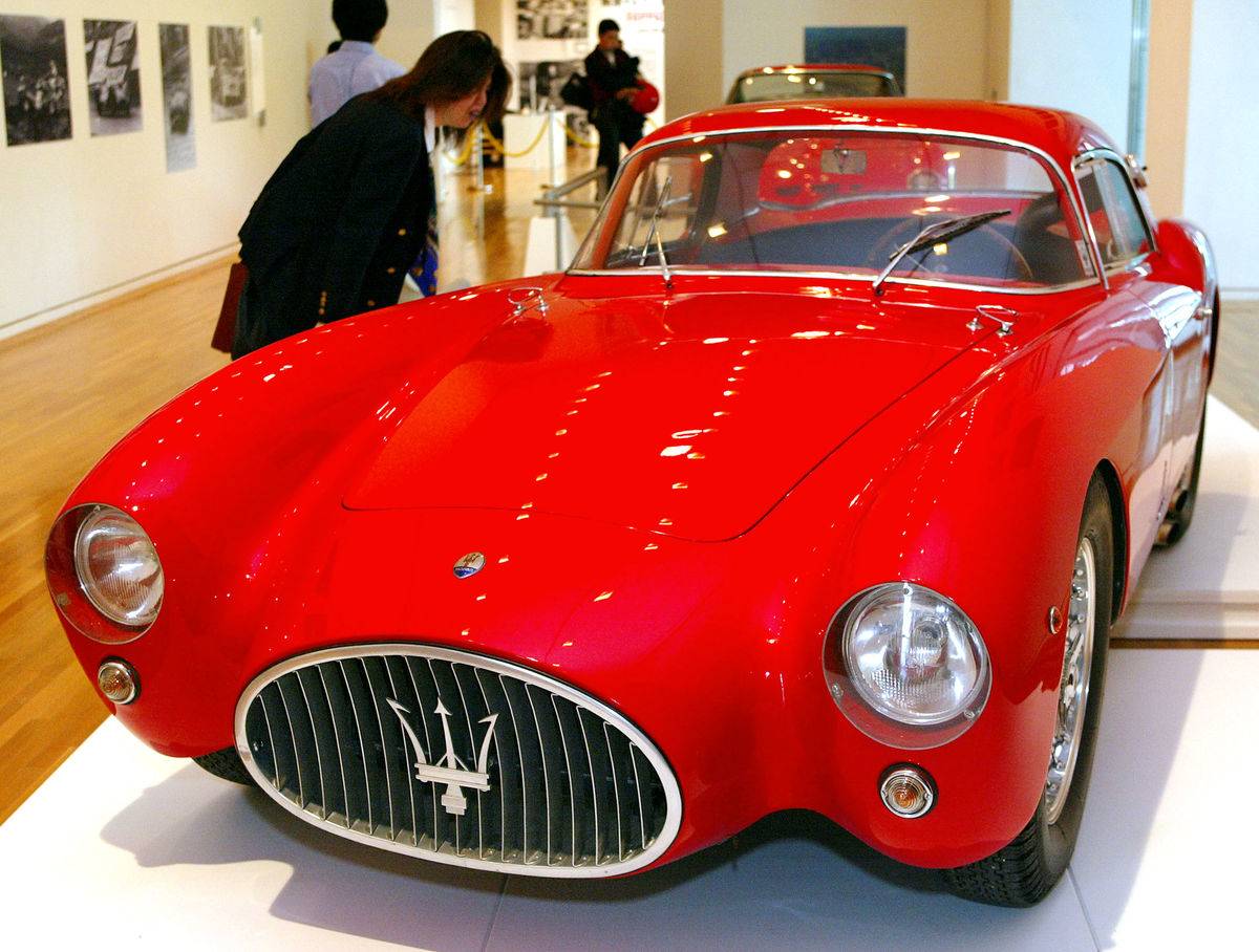 A Japanese sportscar fan admires Maserati A6GCS Be