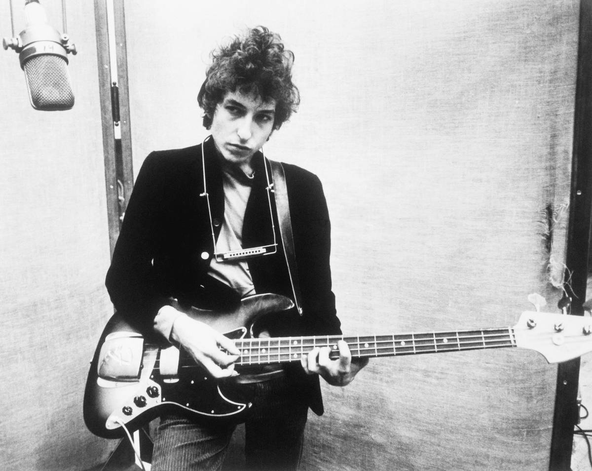 Bob Dylan Holding Bass Guitar