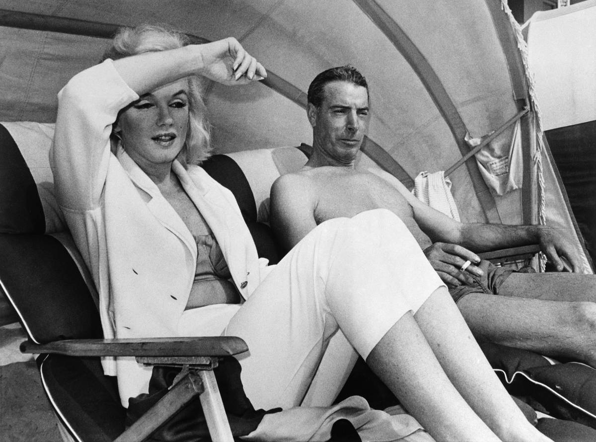 DiMaggio and Monroe Lounging on Beach in Florida