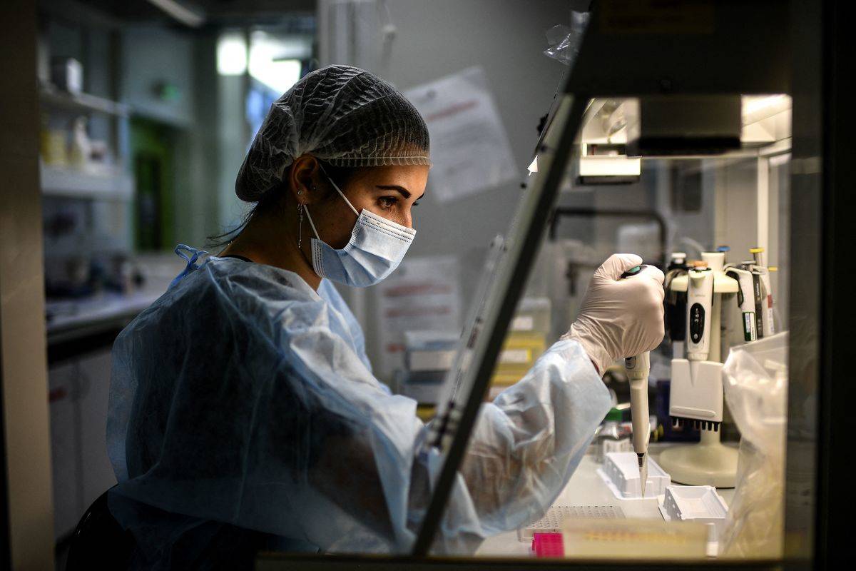 A laboratory technician examined DNA.