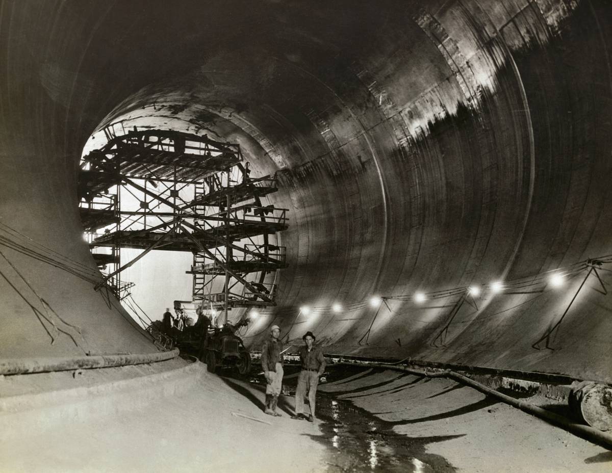 Construction Workers Inside Dam Tunnel