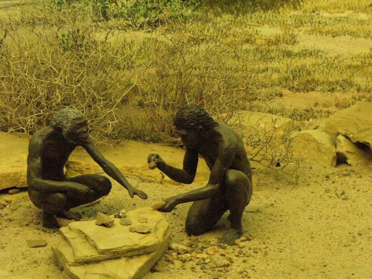 Two ancient humans are represented in this museum display.