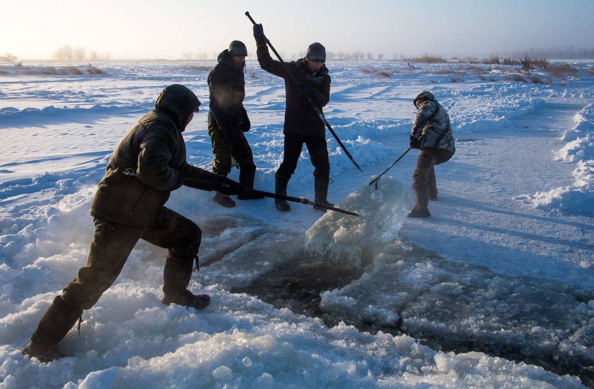 Villagers harvest ice from a lake in the Sakha Republic.