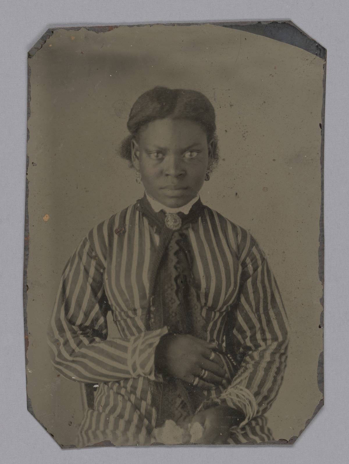 An early Victorian photograph shows a woman staring at the camera.