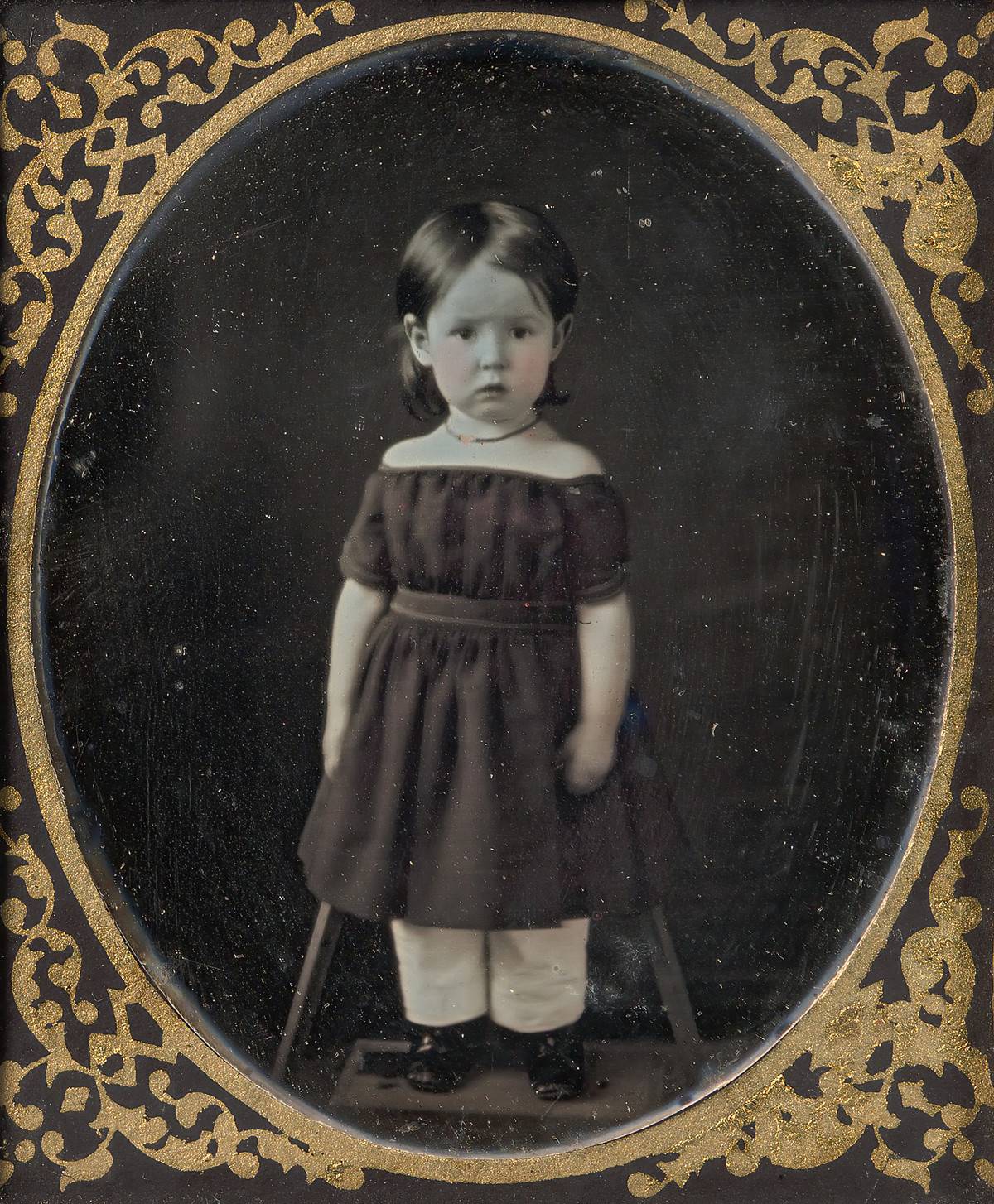 A young girl is photographed between the 1840s and 1850s.
