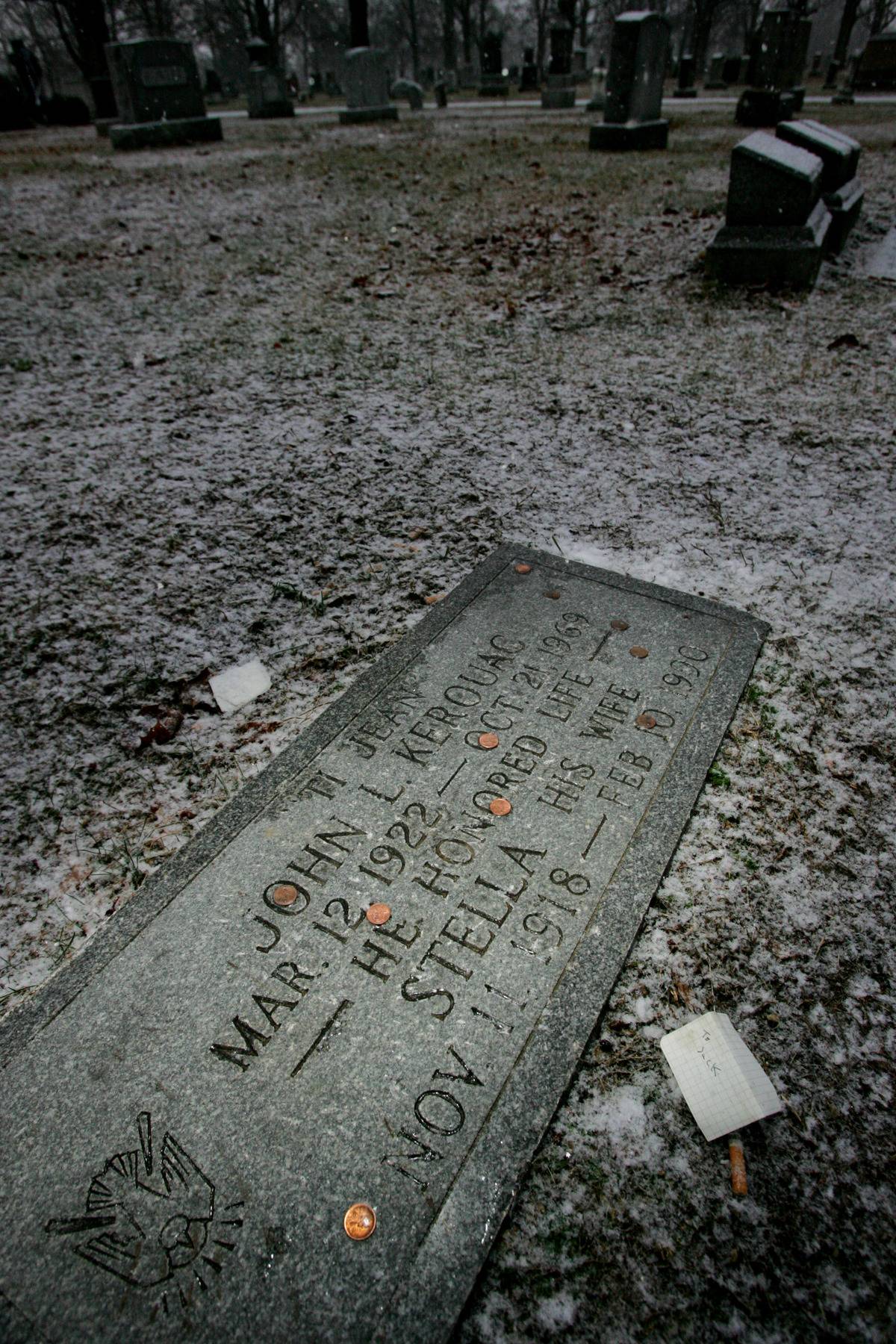 Coins have been placed on top of Jack Kerouac's grave.