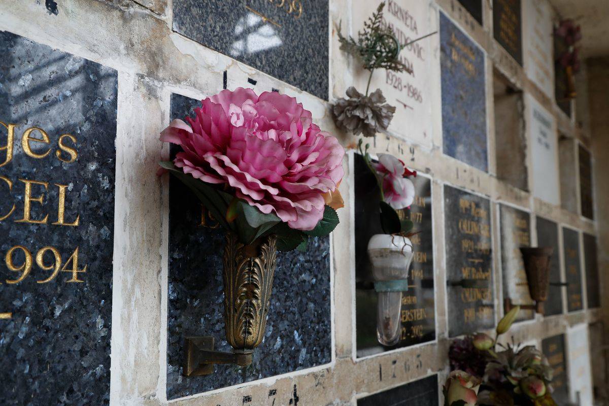 Flowers are laid on funeral urns in the Pere Lachaise cemetery.
