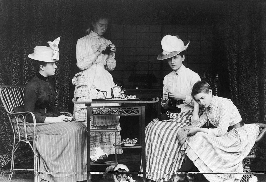 A bored teenage girl at a Victorian tea party