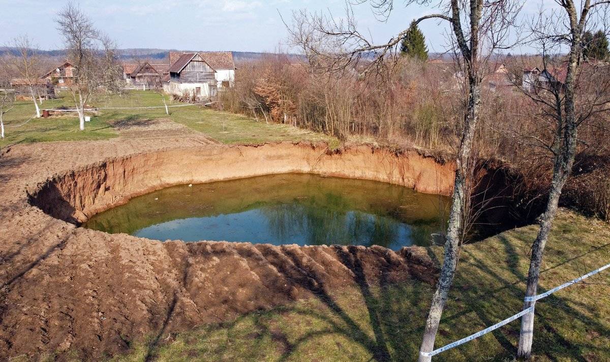 A photo of a large sinkhole that appeared in a small Croatian village following an earthquake.