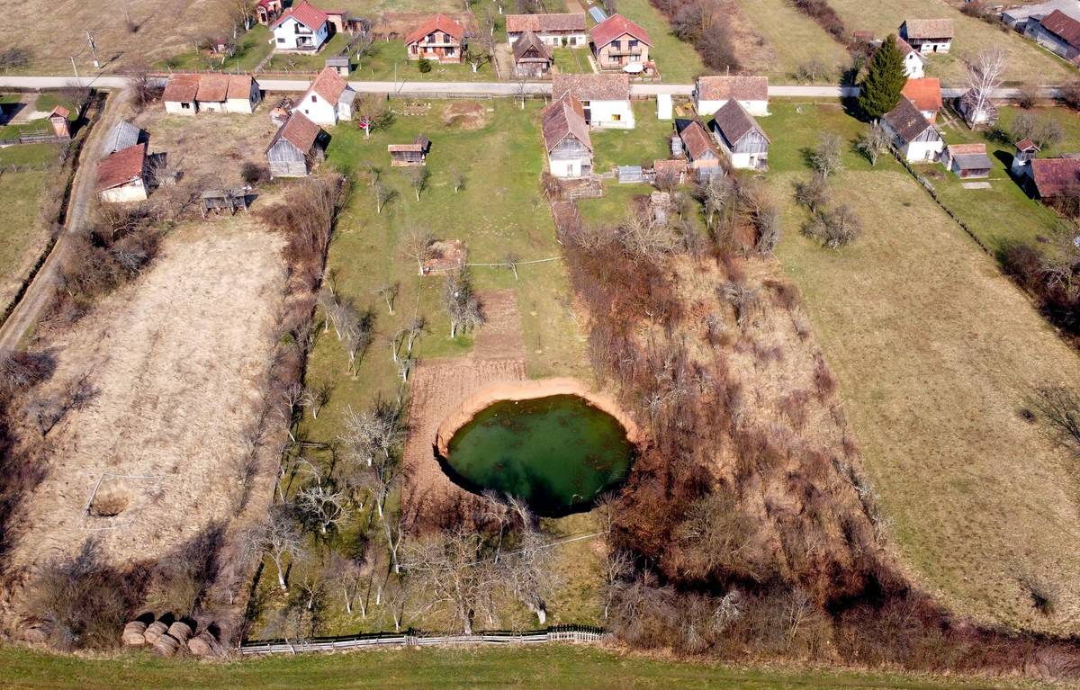A large water-filled sinkhole in the Croatian village of Mečenčani.