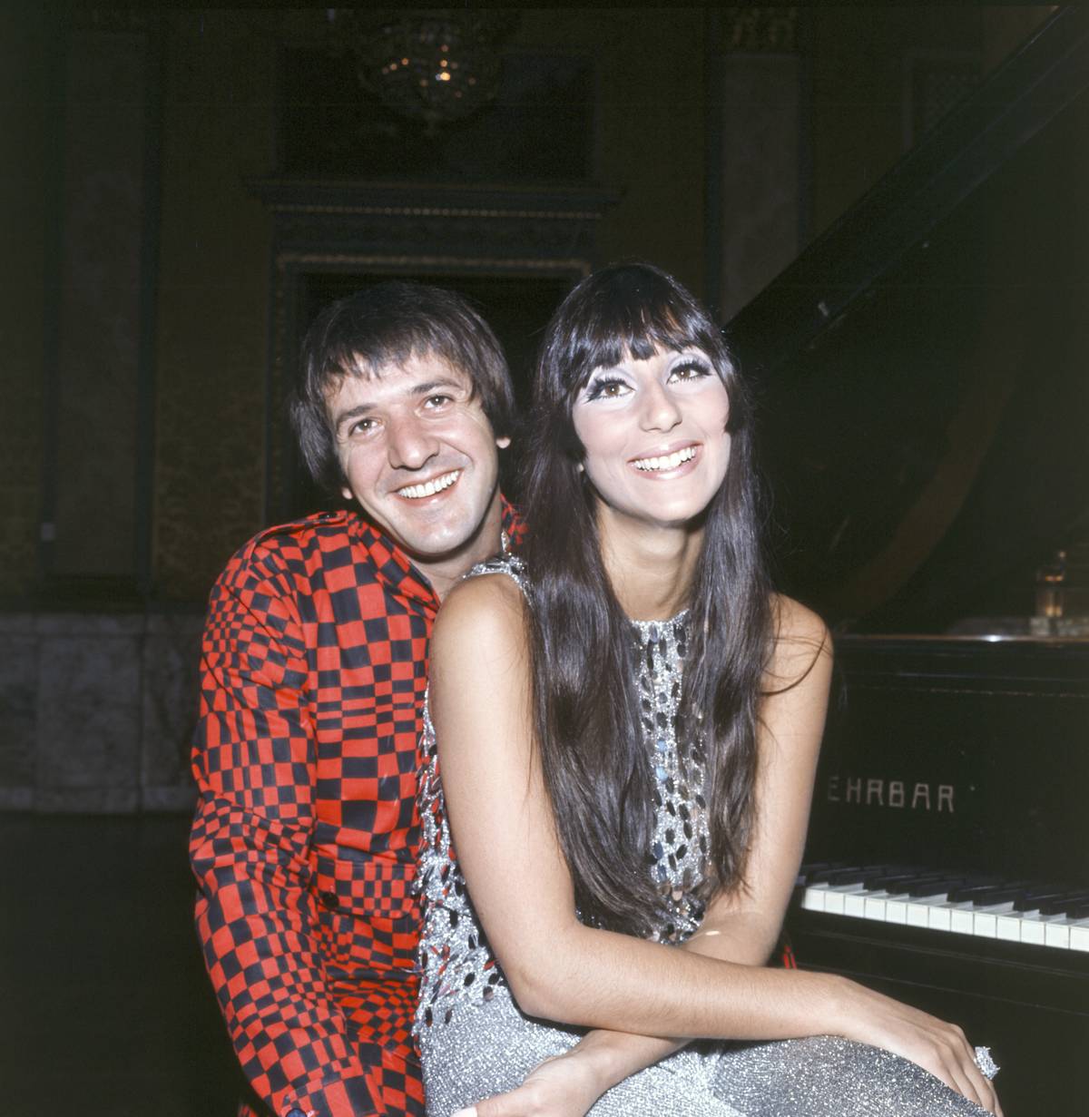 Half-length portrait of smiling Sonny and Cher