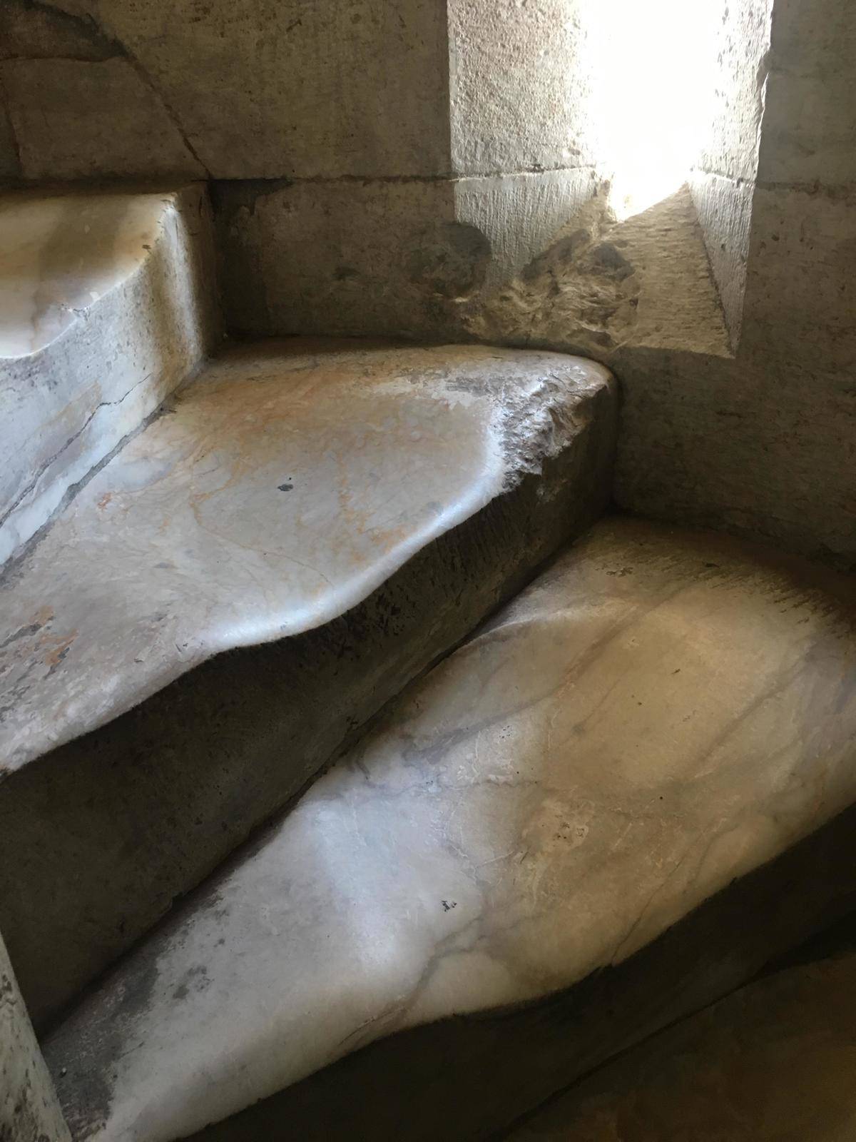 Marble stairs worn smooth from walkers