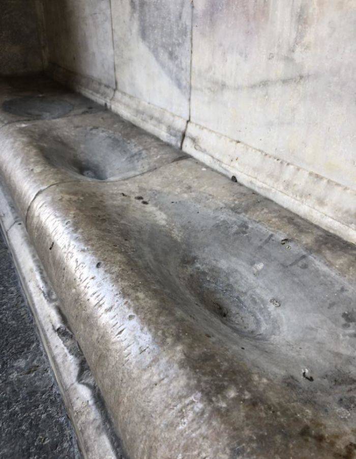Stone worn down from 700 years of rainfall dripping from roof