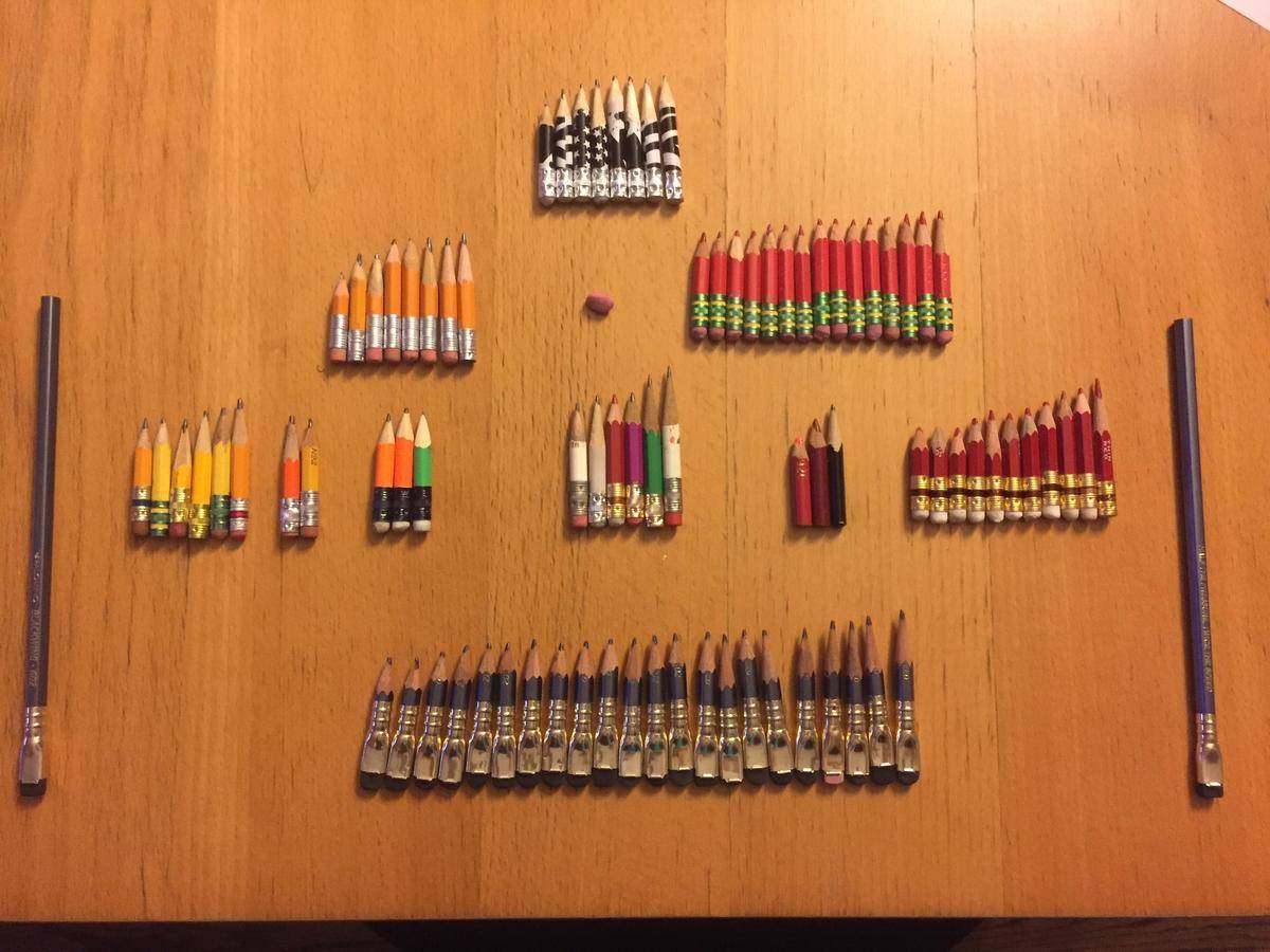 Dozens of pencils that have been sharpened down to stumps