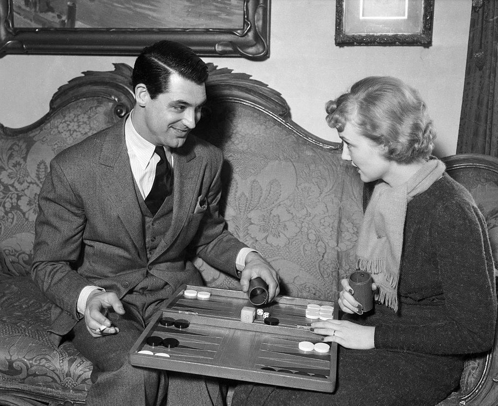 cary grant playing a board game with his wife