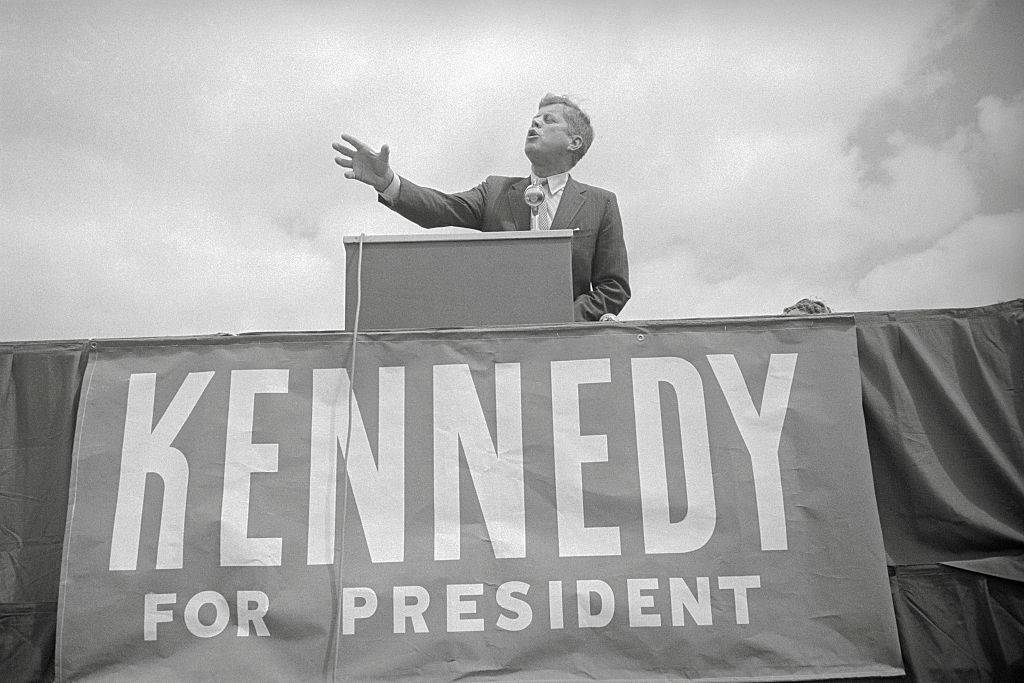 jfk speaking to a crowd while campaigning