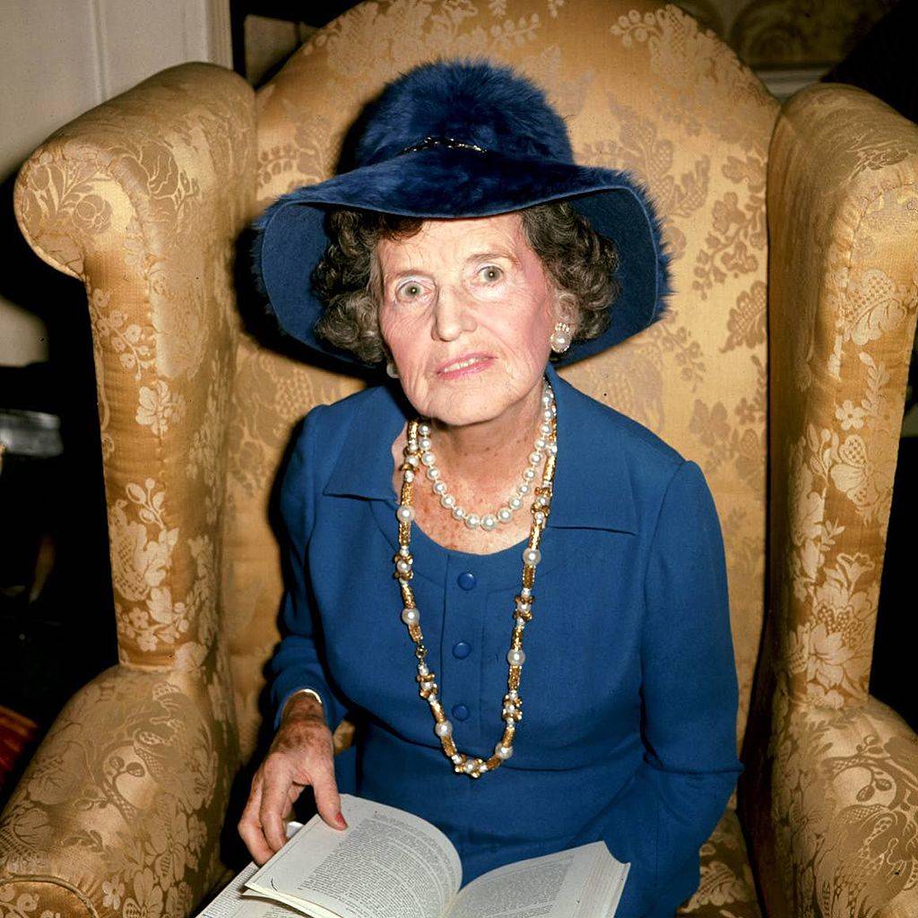 rose kennedy wearing a blue outfit and reading a book