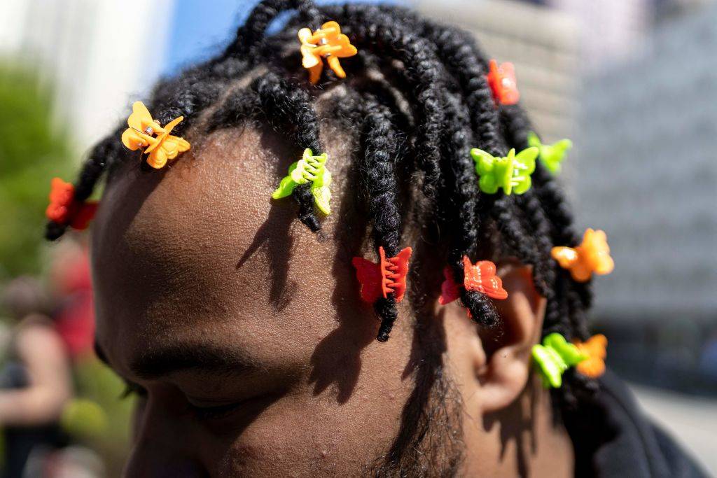 butterfly clips in a man's hair