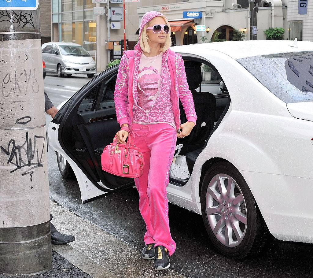paris hilton wearing a pink velour tracksuit