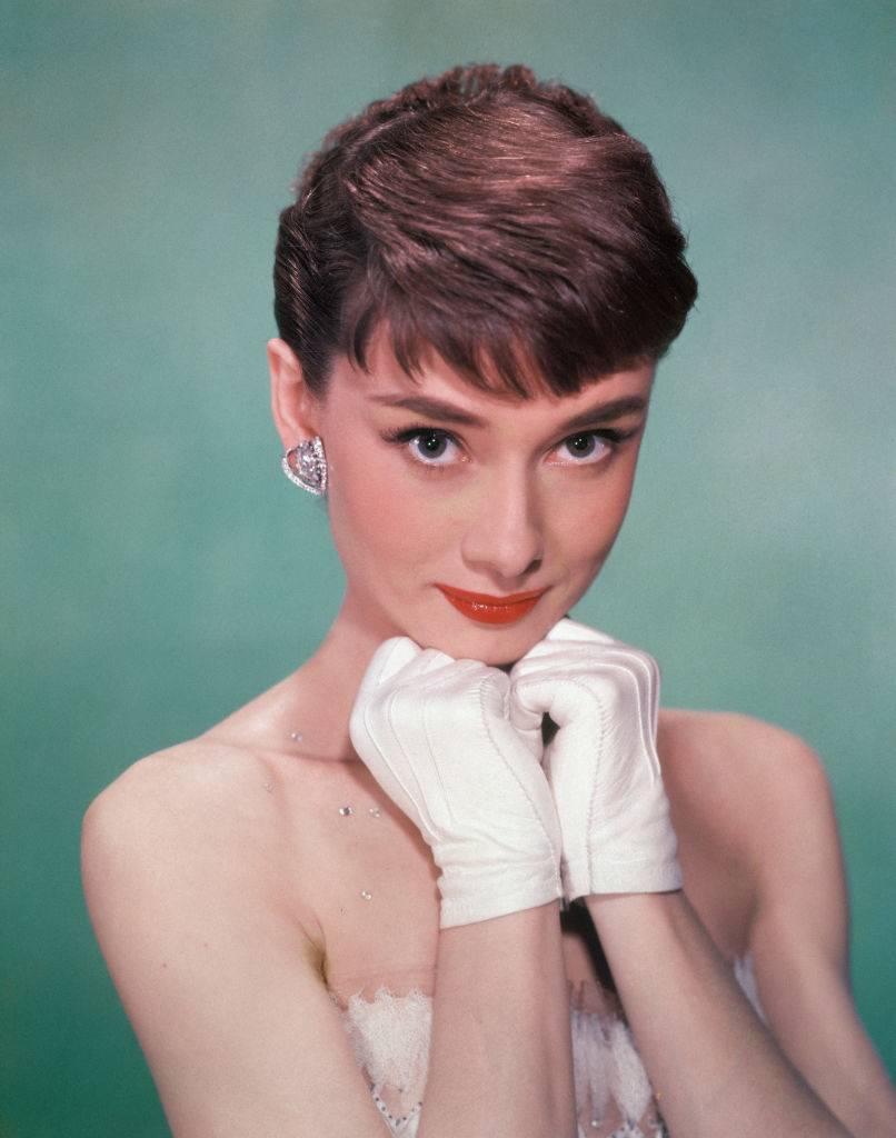 Audrey Hepburn wearing white gloves in the early 1950s