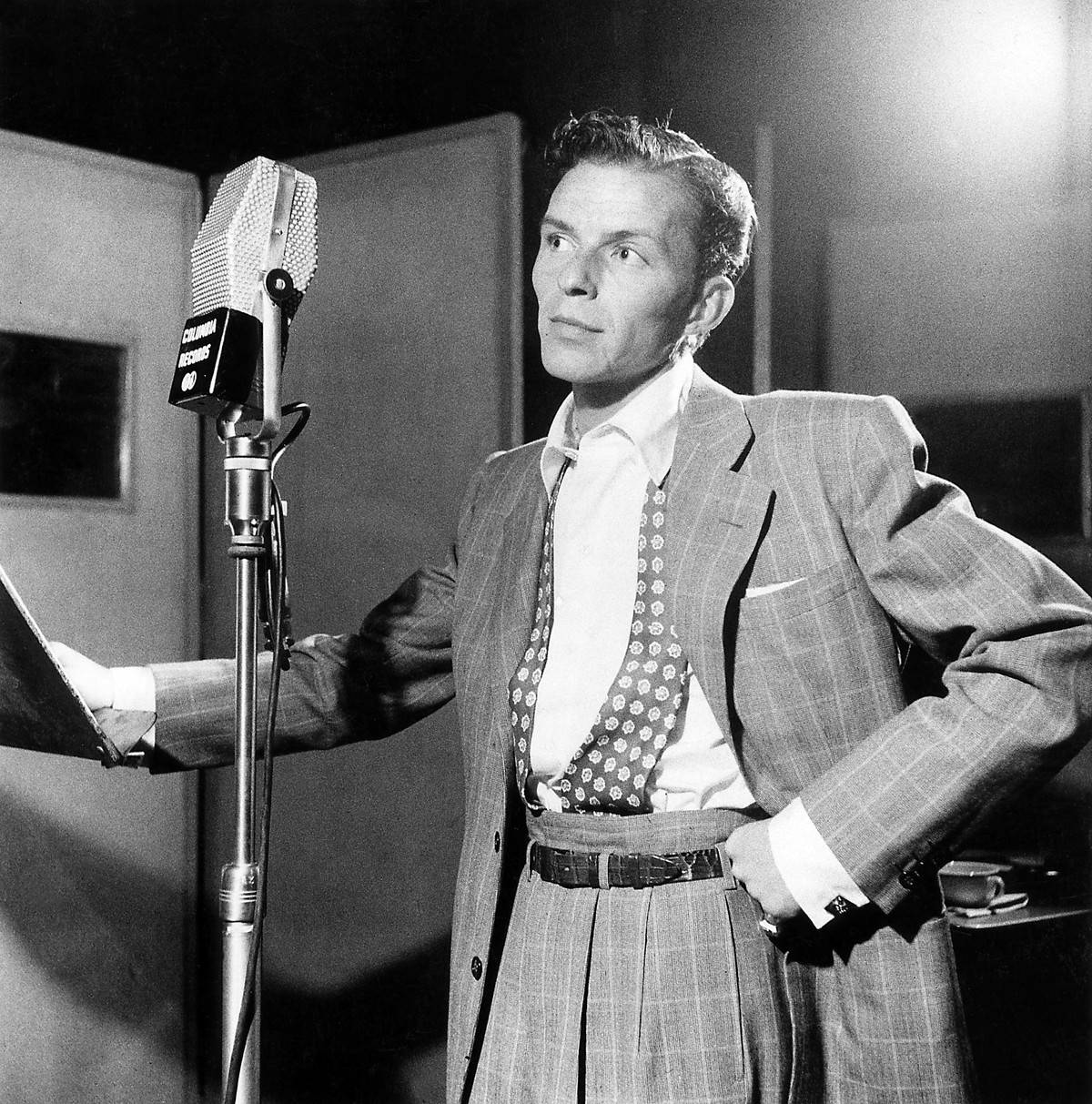 Photo of Frank SINATRA; posed, next to microphone, recording at Columbia Recording studios, Liederkrantz Hall