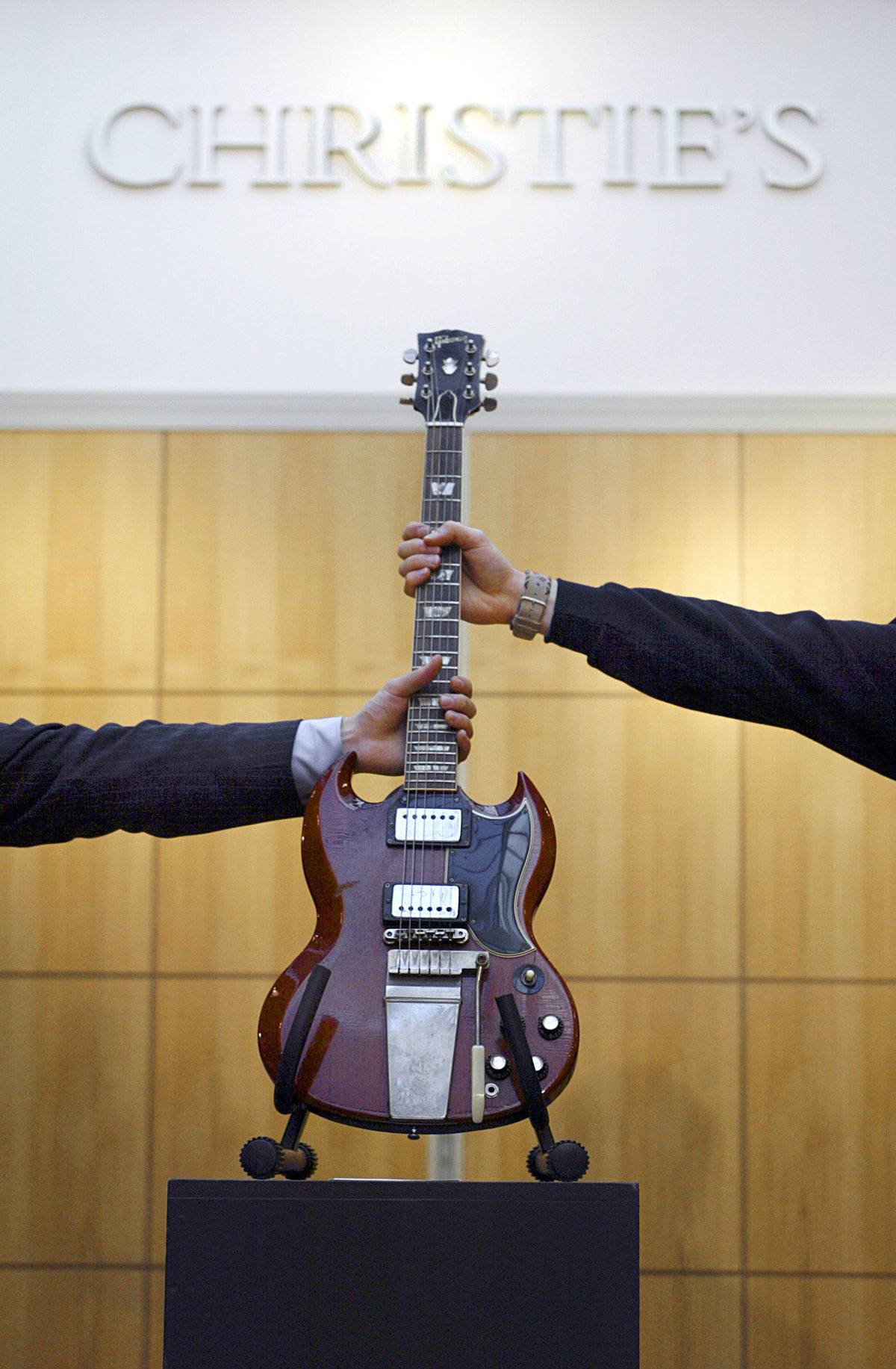 Curators place a Gibson SG guitar once o