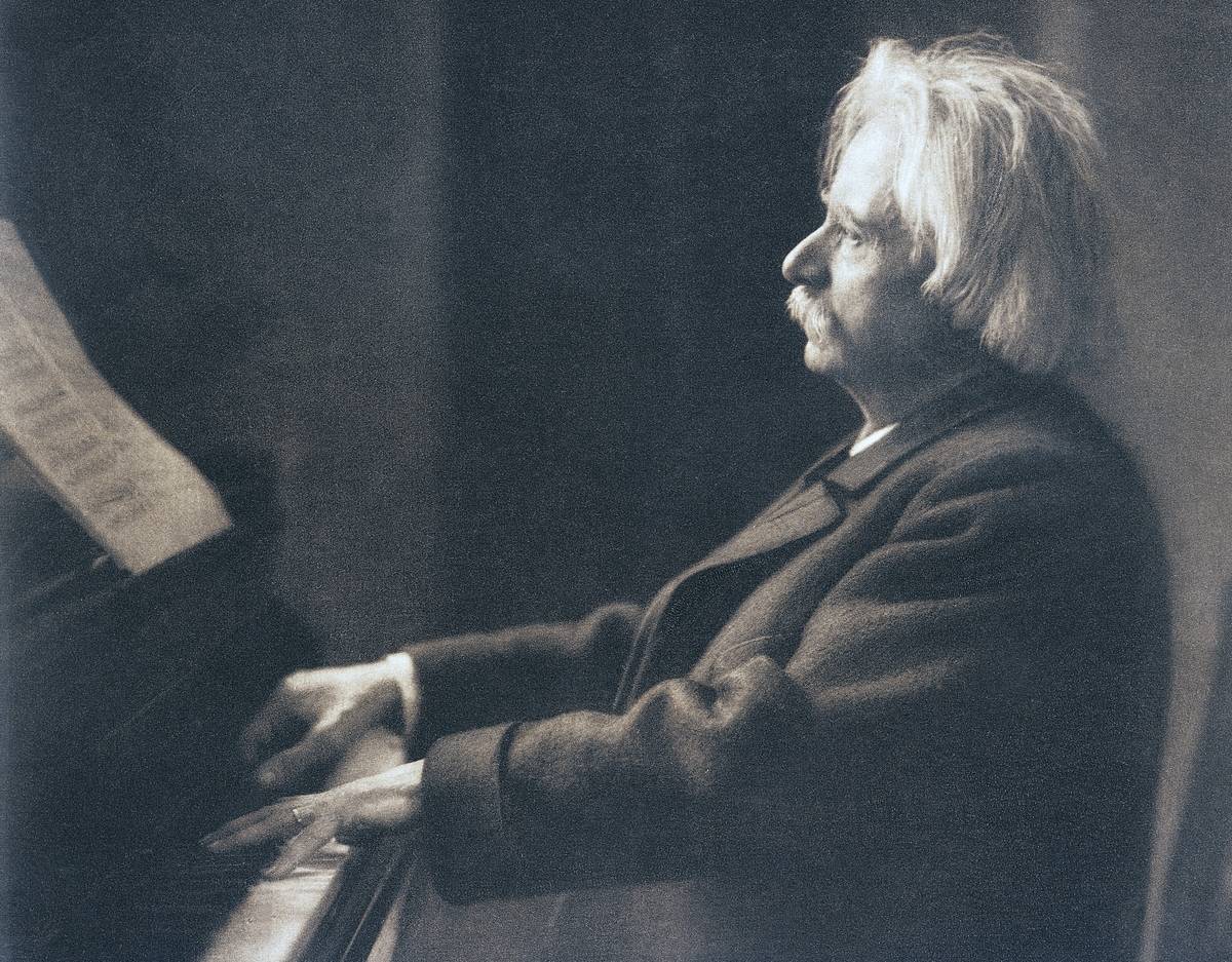 Edward Grieg at the piano in his home on Lake Nordas, Norway.