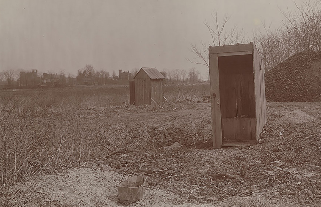 Two outhouses in vintage black and white photo