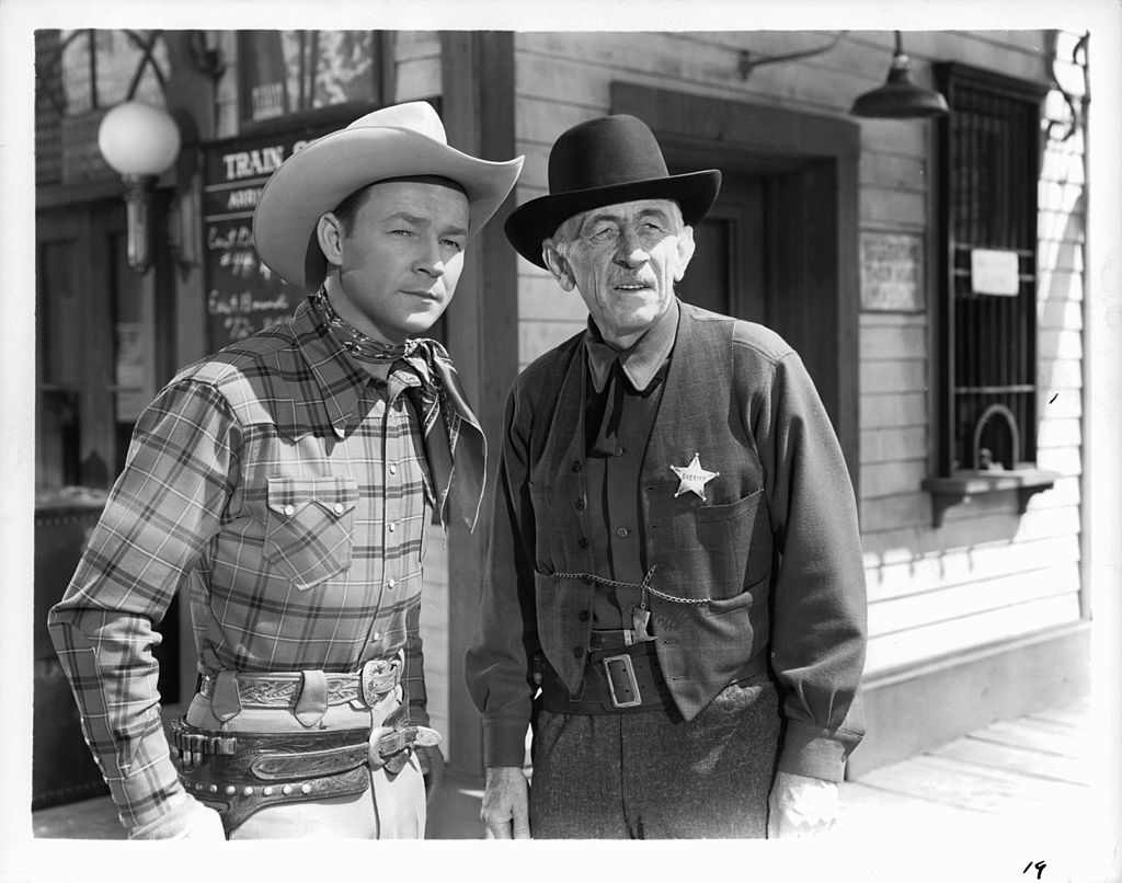 Roy Rogers and costar on set of Western film 