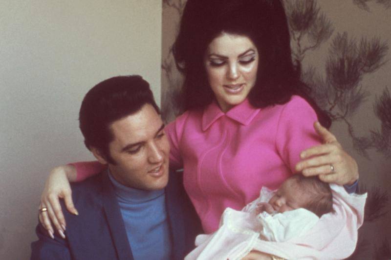 priscilla elvis and baby swaddled hanging together
