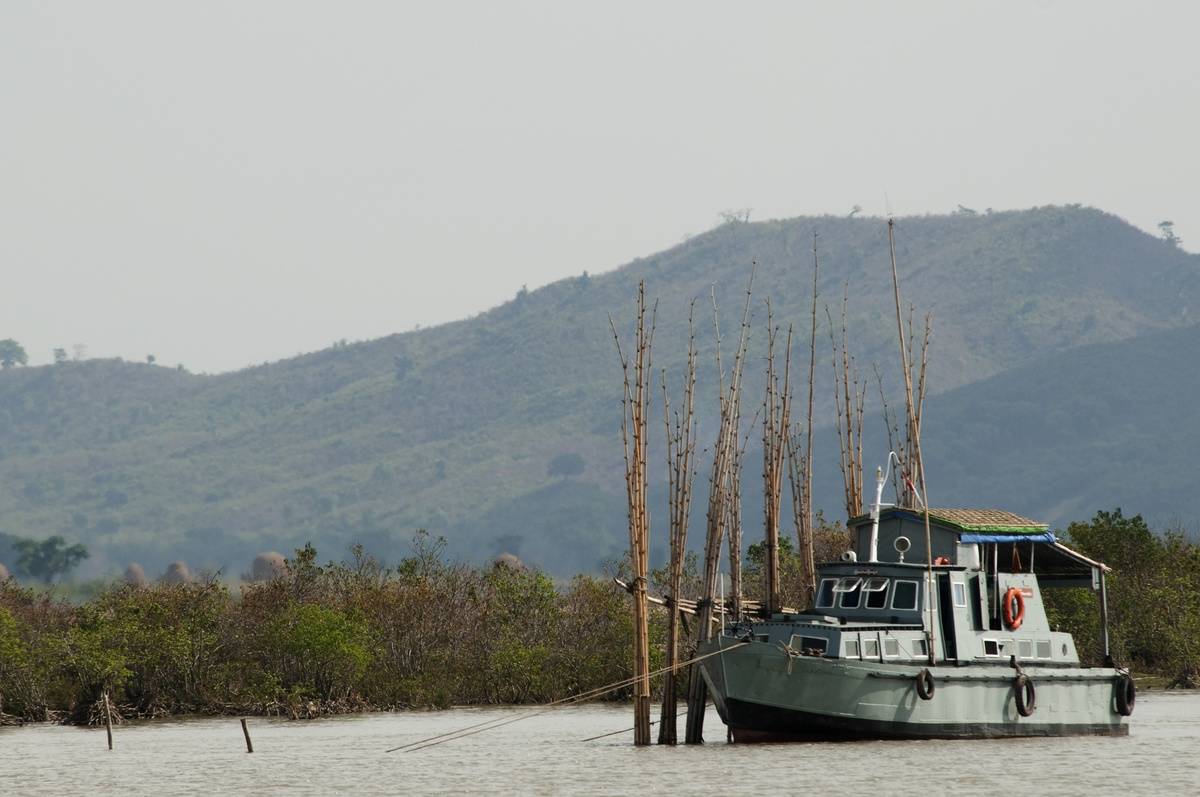 A Burmese Navy boat moors on the Kaladan River...