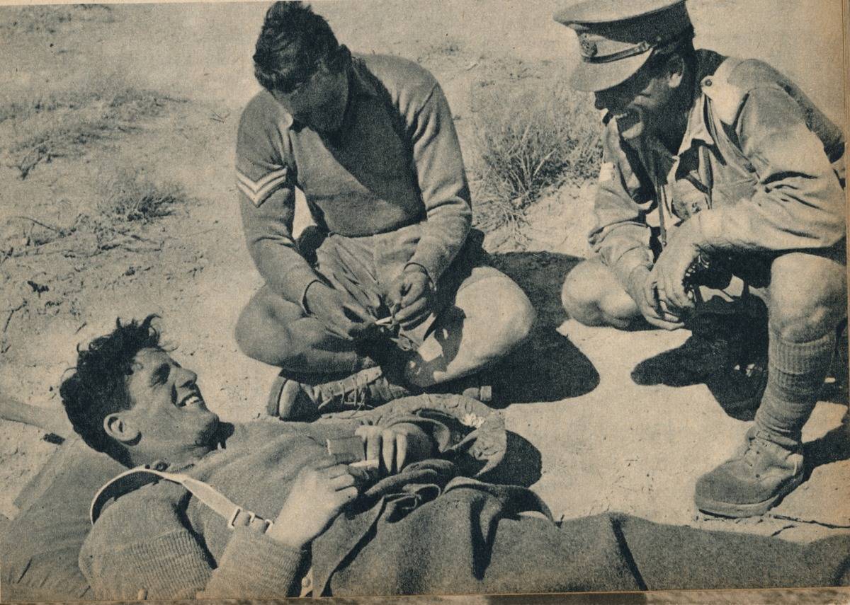 'Ambulance men with a wounded anti-tank gunner', c1942 (1944)