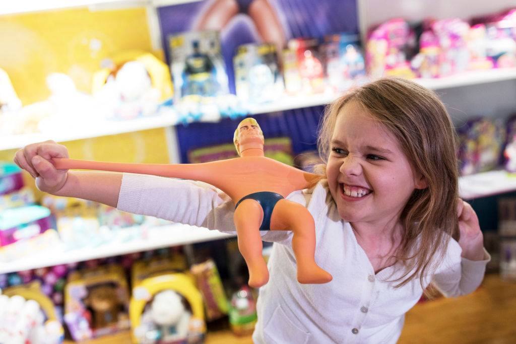 A girl playing with a toy from the 70s