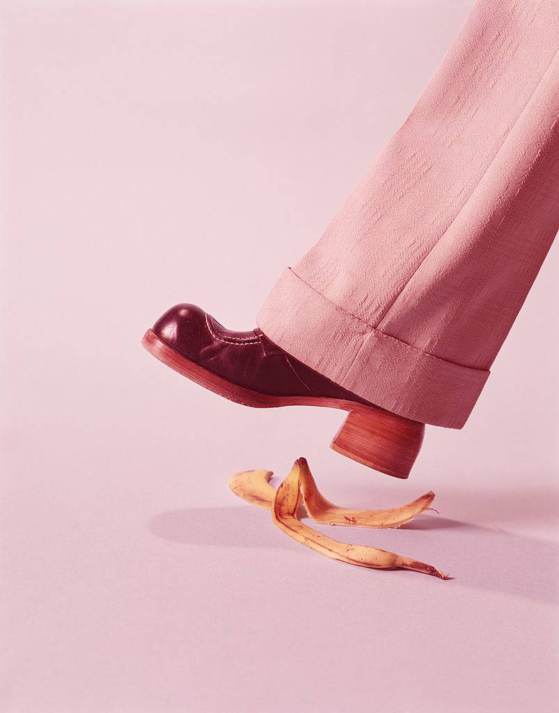 A person stepping on a banana peel